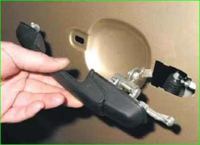 Removing the outer rear door handle