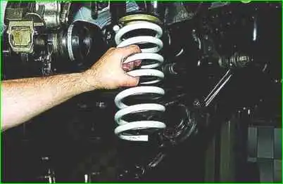 How to replace the front suspension spring VAZ-2123