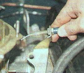 Remove bracket with throttle actuator rod