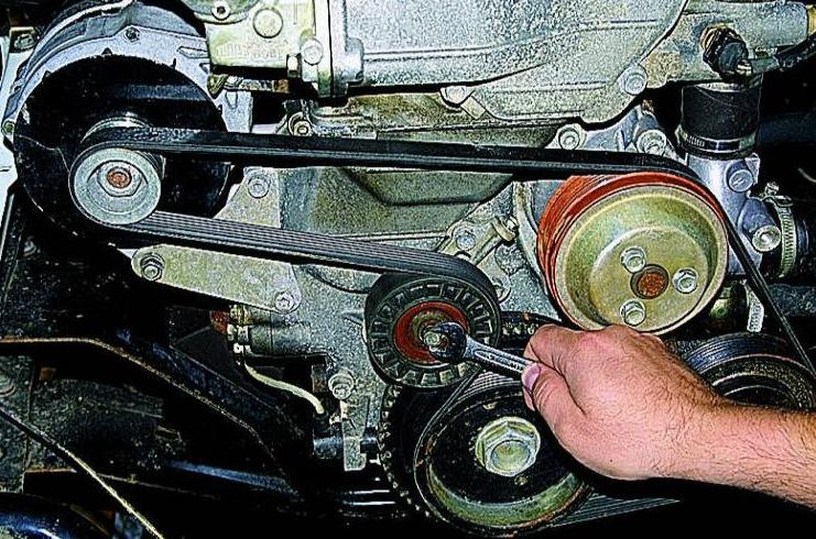 Replacing and adjusting the tension of the accessory drive belt