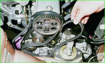 Replacing a timing belt with tension roller