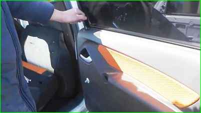 Removing rear door trim of Lada Granta
