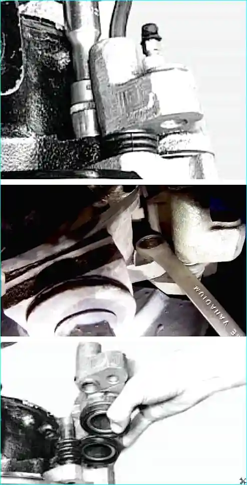 Откручивание болтов крепления тормозного суппорта