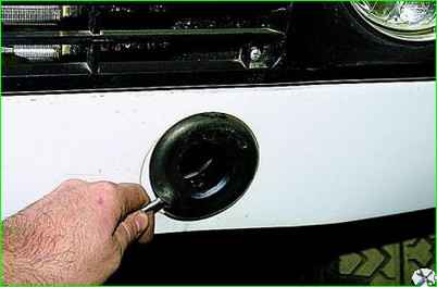 Removing the front bumper of a car