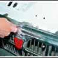 Removing the grille and the upper panel of the radiator lining of the car Gazelle